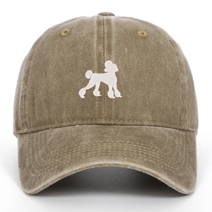 Close-up of white poodle embroidery on vintage washed cotton baseball cap texture