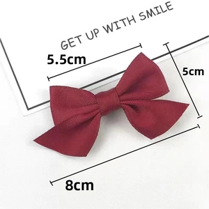 Detail view of burgundy satin bow hair clip showing size dimensions of 8cm by 5cm
