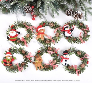 Close-up of 6 Christmas wreaths featuring Santa, snowman, and reindeer figures