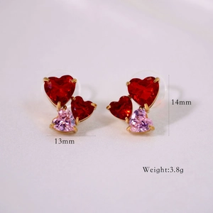 Macro shot of tricolor heart-shaped zircon earrings with dimensions 13mm by 14mm