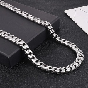 Classic 12mm silver stainless steel cuban link chain necklace for men on black background