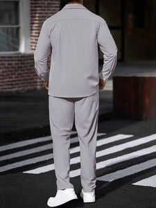 Detailed back view of light purple waffle knit track suit for men on street background