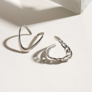 Minimalist silver stainless steel ear cuff set with smooth V-shape and chain design