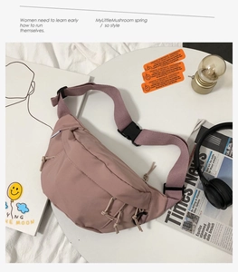Flat lay of pink nylon chest bag with adjustable strap and aesthetic lifestyle props