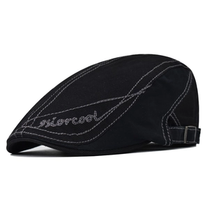 Black cotton newsboy cap with white contrast stitching and adjustable metal buckle back
