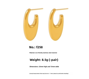 Macro shot of U-shaped gold earrings in polished stainless steel with 25mm height
