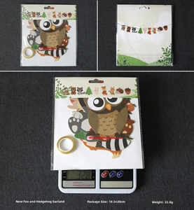 Detail of woodland animal party banner kit with fox and hedgehog paper cutouts