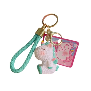Cute white unicorn keychain with pink cheeks and mint green woven strap for bags