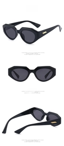 Three-angle view of bright black irregular cat eye sunglasses with gold metal accents