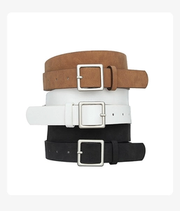Three stacked matte PU leather belts in brown, white, and black with silver square buckles
