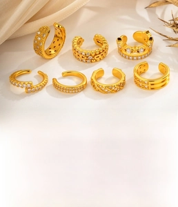 Detailed set of seven gold-plated copper ear cuffs featuring micro-inlaid cubic zirconia