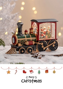 Close-up of a festive Christmas train water globe with Santa Claus on fake snow background
