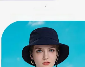 Detail of navy blue sun hat with textured quick-dry fabric and adjustable wind cord