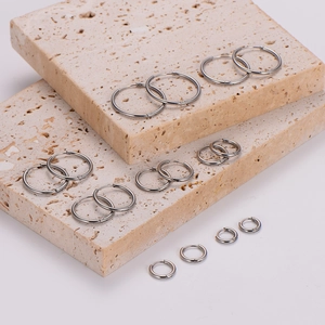 Detailed comparison of seven pairs of polished silver stainless steel hoop earrings in various sizes