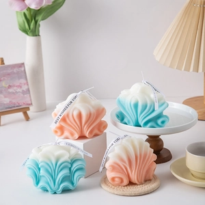 Macro detail of wave patterned aromatherapy candle showing creative gradient color textures