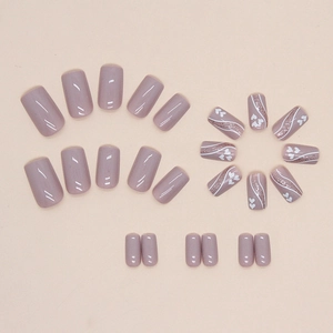 Solid mauve nude press-on nails set with white hearts and silver wavy patterns