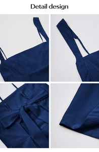 Detail view of navy blue dress with adjustable straps and large back bow tie design