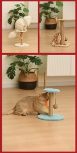 Close-up of sisal cat scratching post with hanging feather toy and plush wood base