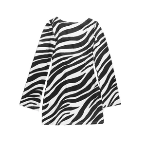 Detailed view of the zebra print texture on a long-sleeved backless mini dress fabric