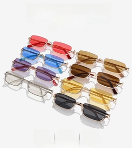 Collection of eight colored rectangular rimless sunglasses with gold metal frames and lenses
