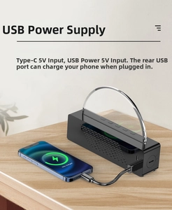 Close-up of LED sunrise alarm clock with wireless charging and USB output ports