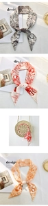 Detail view of retro Toile de Jouy silk scarves tied on handles and showing patterns
