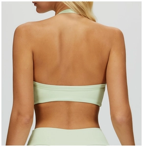 Detail of mint green halter back yoga bra with high elastic seamless matte fabric