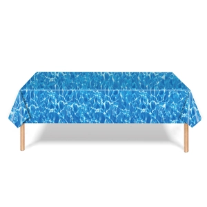 Close-up of ocean wave pattern rectangular tablecloth on a wooden table setup