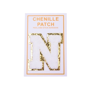 Detail of 8cm white chenille letter N patch with gold glitter border and self-adhesive back