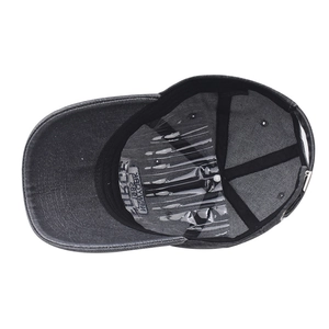 Detail view of the washed denim baseball cap interior with moisture-wicking sweatband