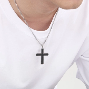 Men's titanium steel necklace with black cross pendant and silver chain on model