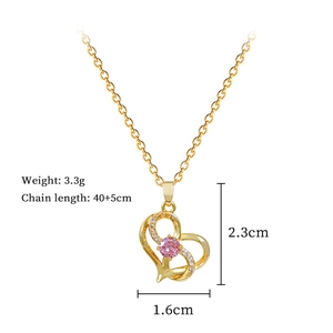 Detail of gold heart necklace with pink stone, showing dimensions 2.3x1.6cm and 3.3g weight
