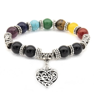 Detailed view of heart charm bracelet featuring black lava and multicolor natural stones