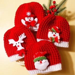 Set of 4 festive knitted Christmas hats for infants featuring reindeer and snowman patches