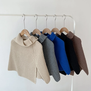 Knitted high-neck poncho scarf with side slits in beige, grey, blue, black, and brown