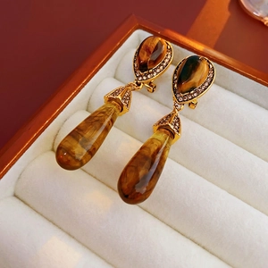Vintage gold teardrop earrings featuring tiger eye stones and sparkling crystal accents