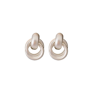 Minimalist silver interlocking double hoop metal earrings on a clean white background