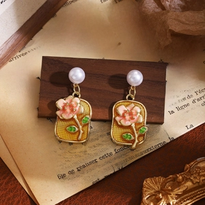 French style floral pearl earrings with pink enamel flowers on vintage wood display