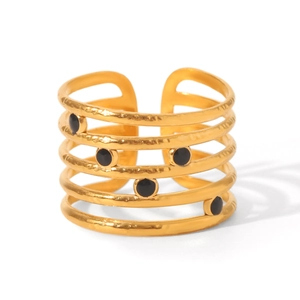 Detail of 18K gold plated multi-layer cutout ring with round black enamel dots