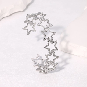 Bracelet jonc ouvert en acier inoxydable argenté avec motifs d'étoiles évidées