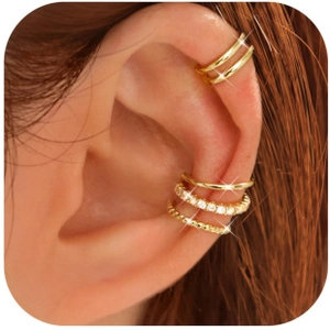 Detailed close-up of a gold ear cuff set with rhinestones and twisted metal textures