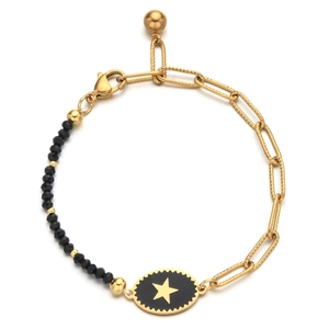 Detail of gold paperclip chain and black faceted beads bracelet with star charm