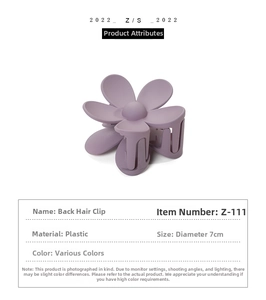 Detail view of light purple flower hair claw clip with 7cm diameter and matte texture