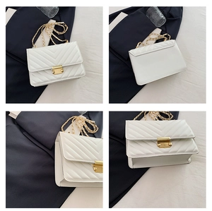 Detailed views of white quilted crossbody bag with chevron pattern and gold chain strap