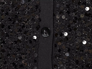 Detail of shimmering black sequins and matching resin buttons on this stylish knit cardigan
