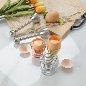 304 stainless steel egg opener set with colorful spring egg cups on marble countertop