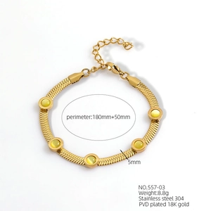 Detail of 18K gold plated stainless steel snake chain with five round yellow gemstones