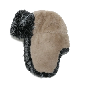 Close-up of thick faux fox fur texture and warm plush lining on a winter trapper hat