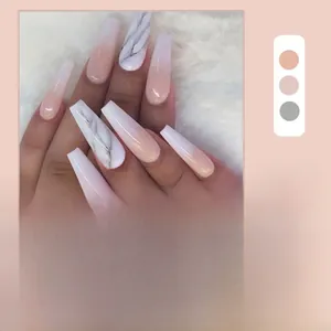 Macro view of long coffin nails featuring pink gradient and marble art pattern