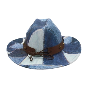 Detail of western patchwork denim cowboy hat with brown leather band and adjustable drawstring